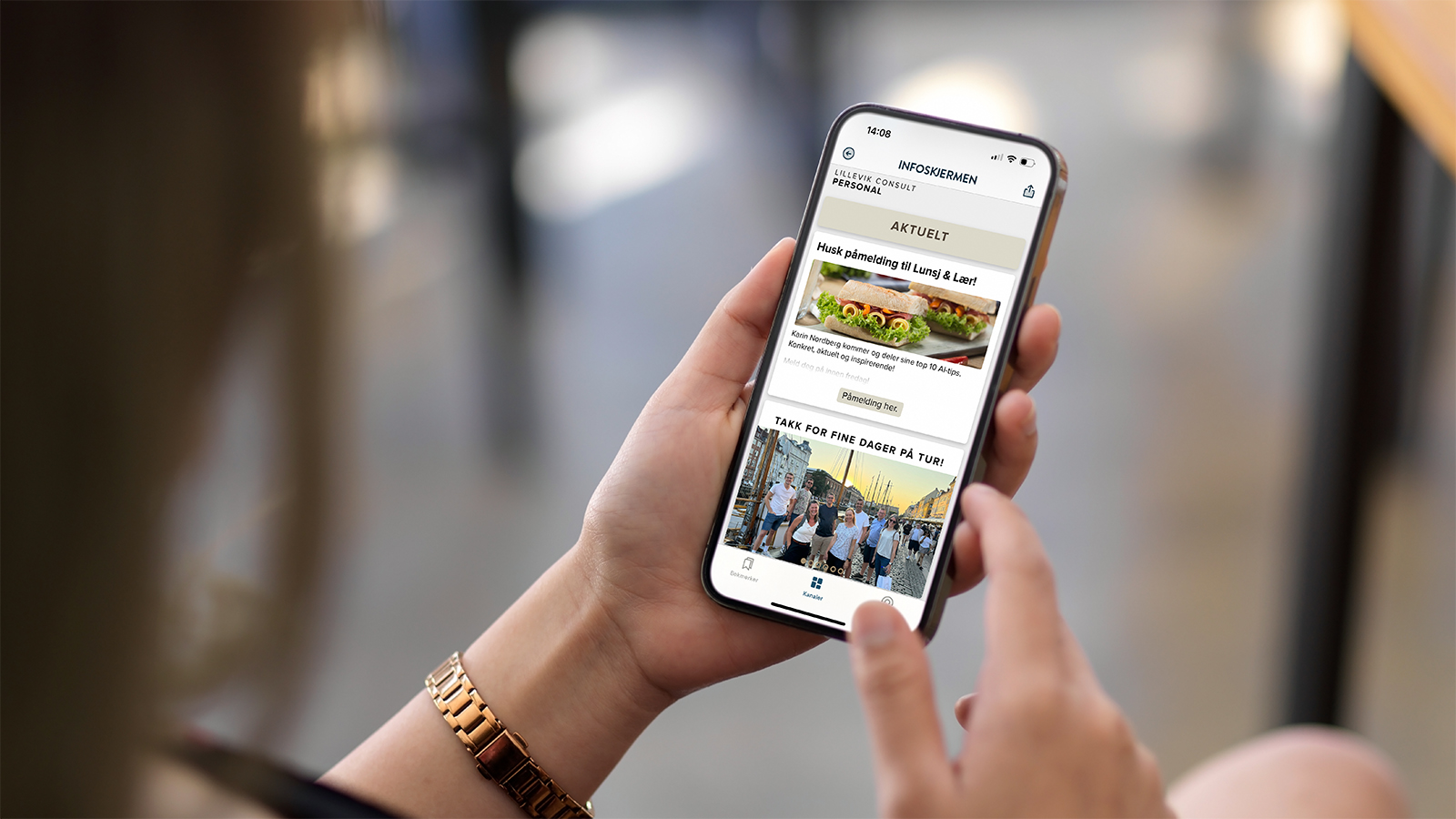 Woman holding a phone showing PinToMind Go