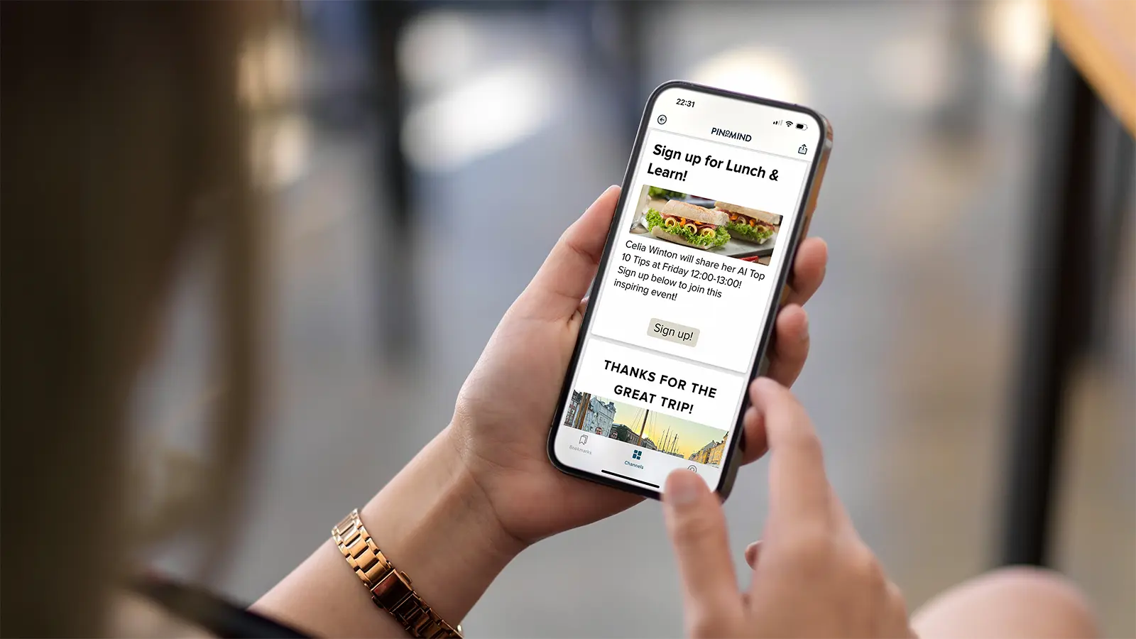 A person using PinToMind Go on a mobile phone with enlarged text for improved readability.