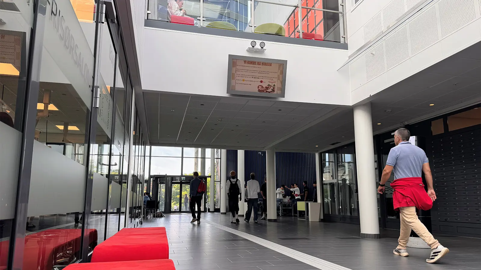 A digital signage screen overlooking the school’s spacious foyer.
